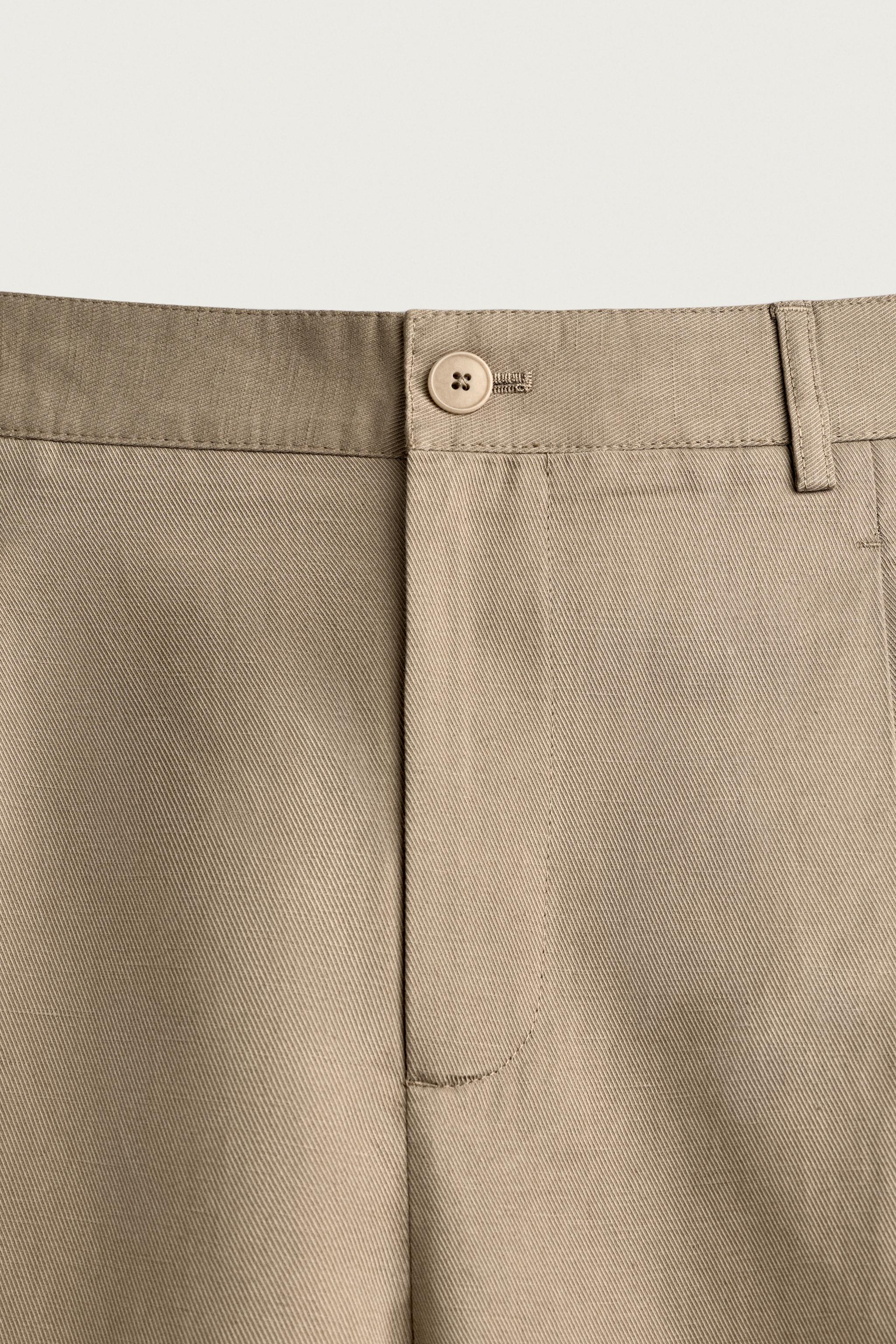 RELAXED FIT PLEATED PANTS